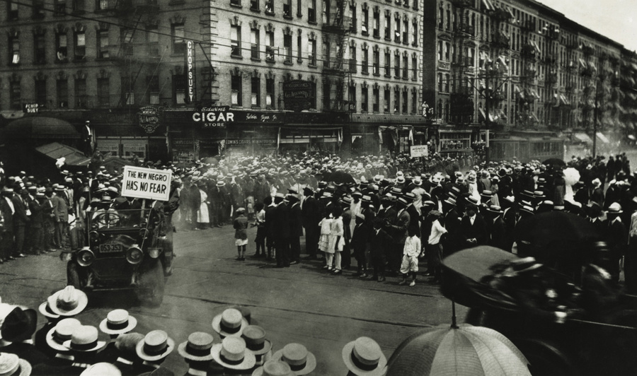 Universal Negro Improvement Association (UNIA) parade in Harlem, 1920. UNIA was a black nationalist fraternal organization led by Marcus Garvey. One car displays a sign reading, 'THE NEW NEGRO HAS NO FEAR'  (BSLOC_2017_20_169)